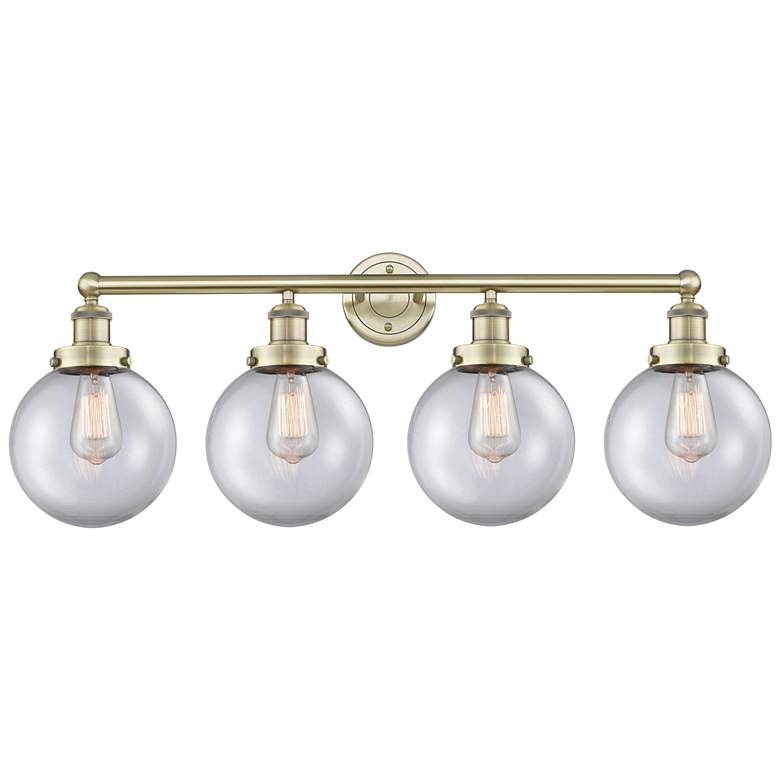Image 1 Large Beacon 33.5"W 4 Light Antique Brass Bath Light With Clear Shade