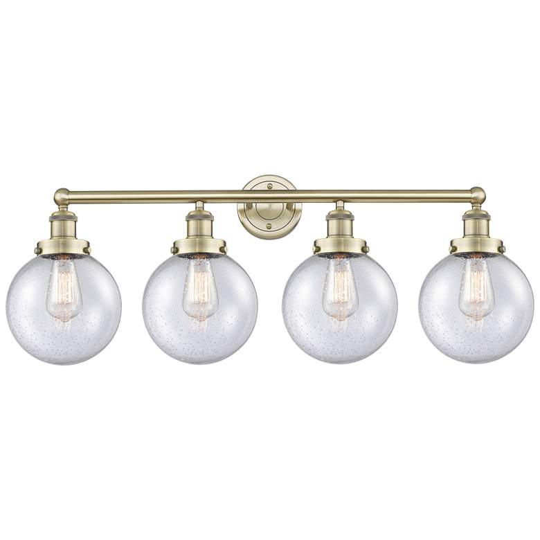 Image 1 Large Beacon 33.5"W 4 Light Antique Brass Bath Light With Seedy Shade