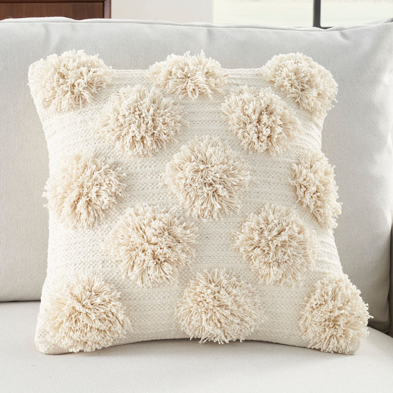 White pillows 2025 with pom poms