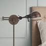 Thumbnail1 of Linthal Rust Adjustable Plug-In Swing Arm Wall Lamp