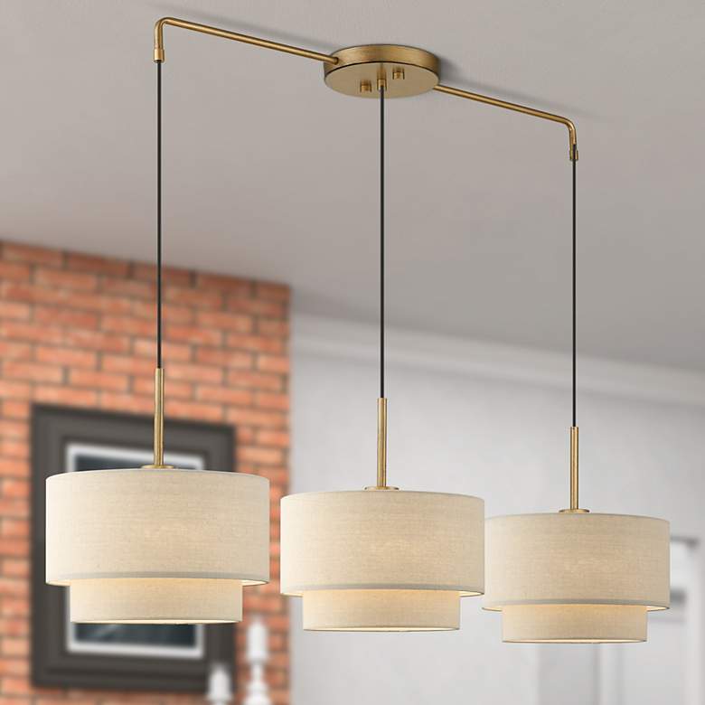Image 1 Livex Bellingham 49" Wide 3-Light Gold Leaf Linear Shade Chandelier