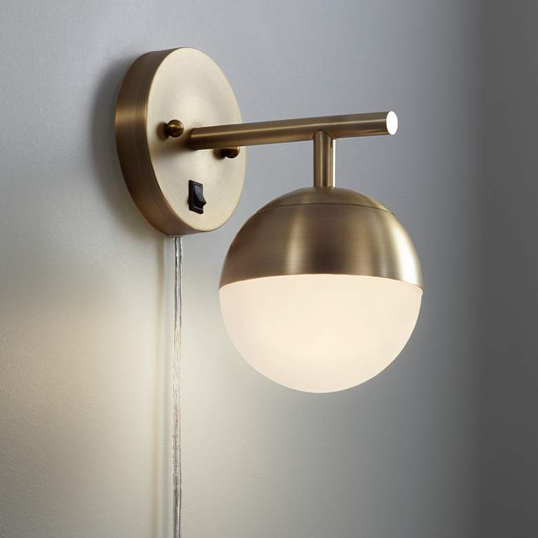 Image 1 Luna Brass and White Glass Globe Modern Plug-In Wall Lamp