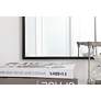 Mason Black Metal 18" x 36" Vanity Wall Mirror in scene