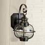 Maxim Nautington 13" High Bronze and Seeded Glass Outdoor Wall Lantern in scene
