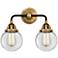 Nouveau 2 Beacon 6" 2 Light 14" Bath Light - Black Brass - Clear
