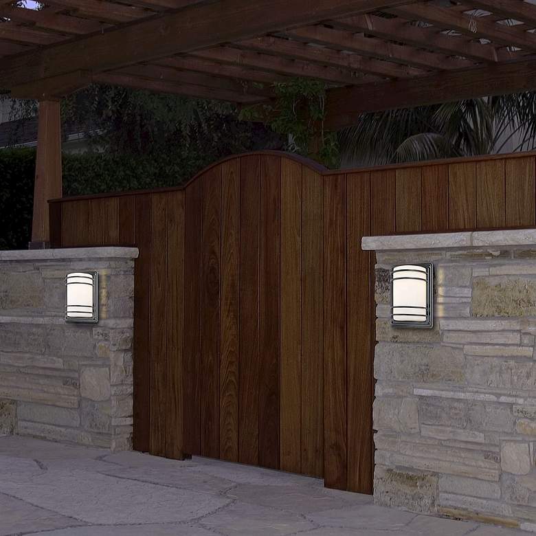 Image 1 John Timberland Habitat 11" High Bronze Opal Glass Outdoor Wall Light in scene