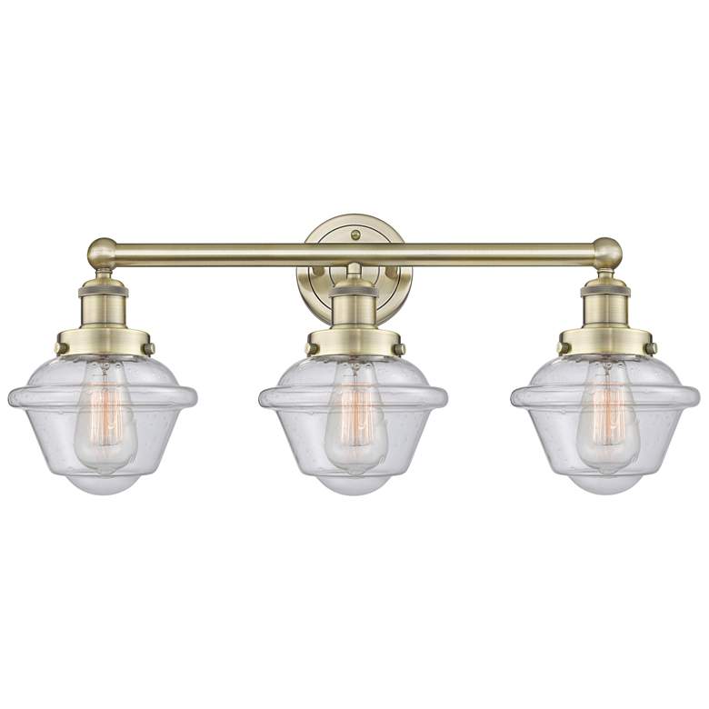 Image 1 Oxford 24.5" Wide 3 Light Antique Brass Bath Vanity Light With Seedy S