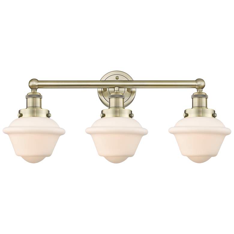 Image 1 Oxford 24.5"W 3 Light Antique Brass Bath Vanity Light With White Shade