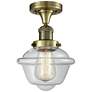 Oxford 7.5" Wide Antique Brass Semi Flush Mount w/ Clear Shade