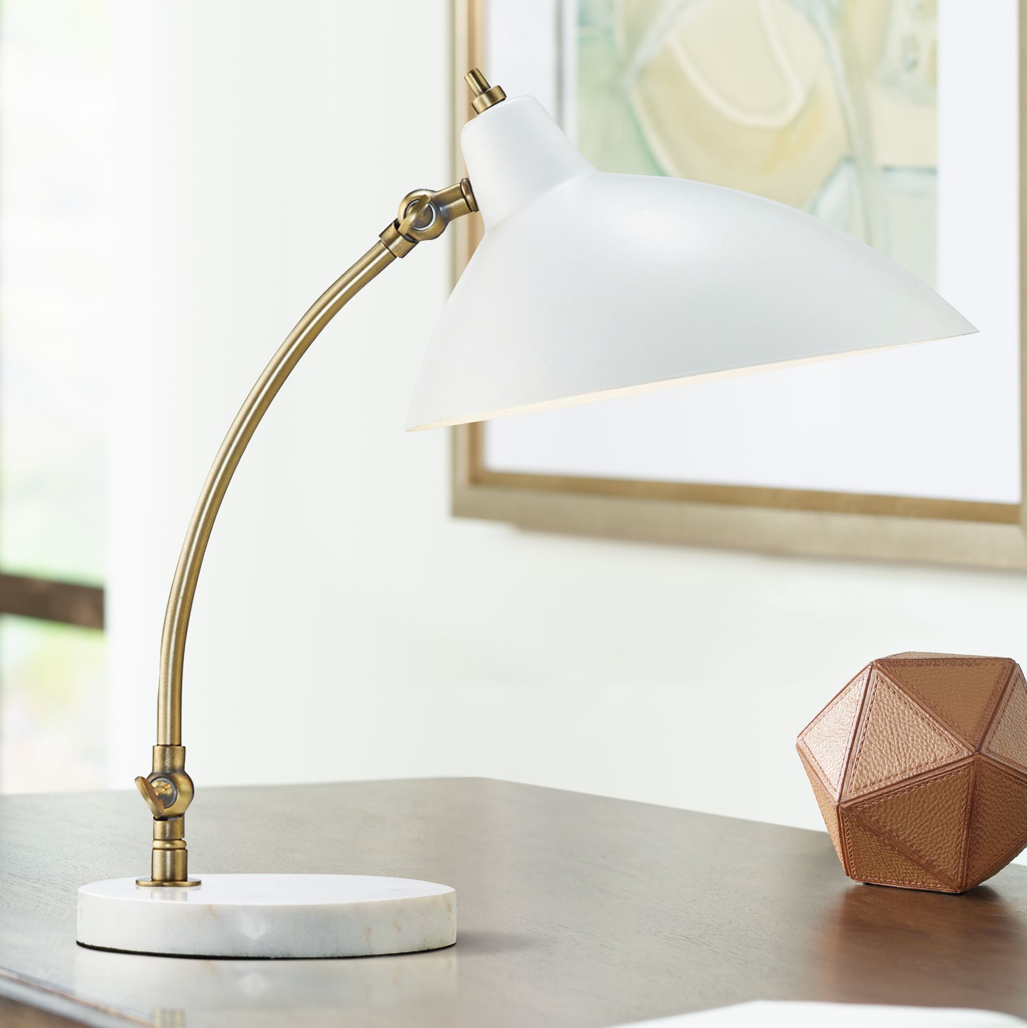 white and brass desk lamp