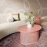 Pesky 32" Wide Coral Pink Oval Coffee Table in scene