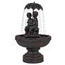 Boy and Girl Under Umbrella Fountain