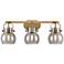 Pilaster II Sphere 26.5"W 3 Light Brushed Brass Bath Light w/ Smoke Sh