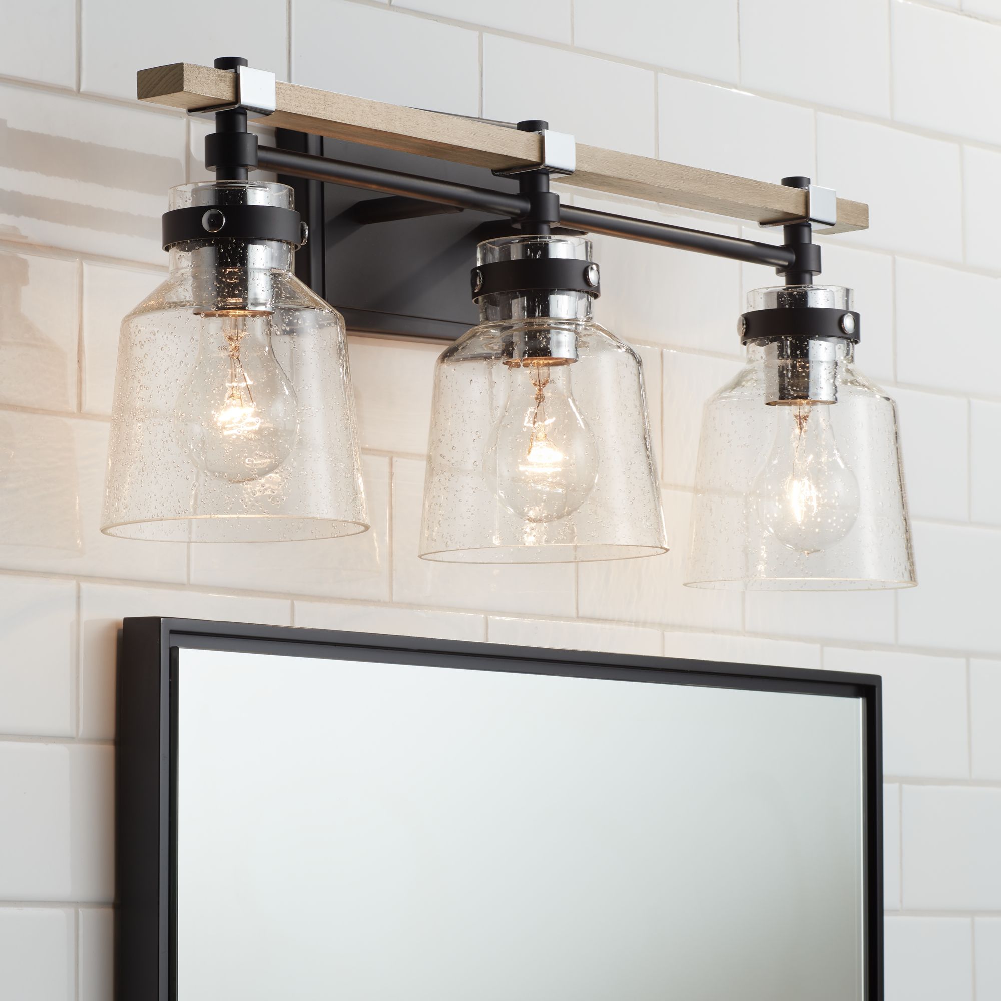 Possini Broadway 23" Wide Black and Painted Wood 3-Light Bath Light in scene