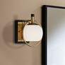 Possini Euro Carlyn 9 1/2" High Antique Brass and Black Wall Sconce in scene