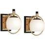 Watch A Video About the Possini Euro Carlyn Brass and Black Wall Sconces Set of 2