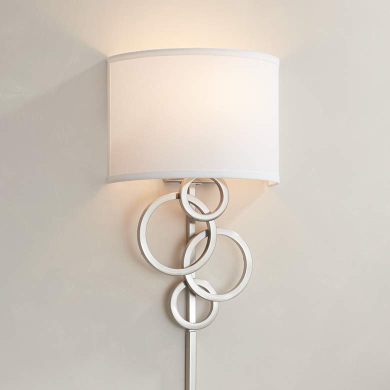 Image 1 Possini Euro Design Circles Modern Plug-In Wall Sconce with Cord Cover