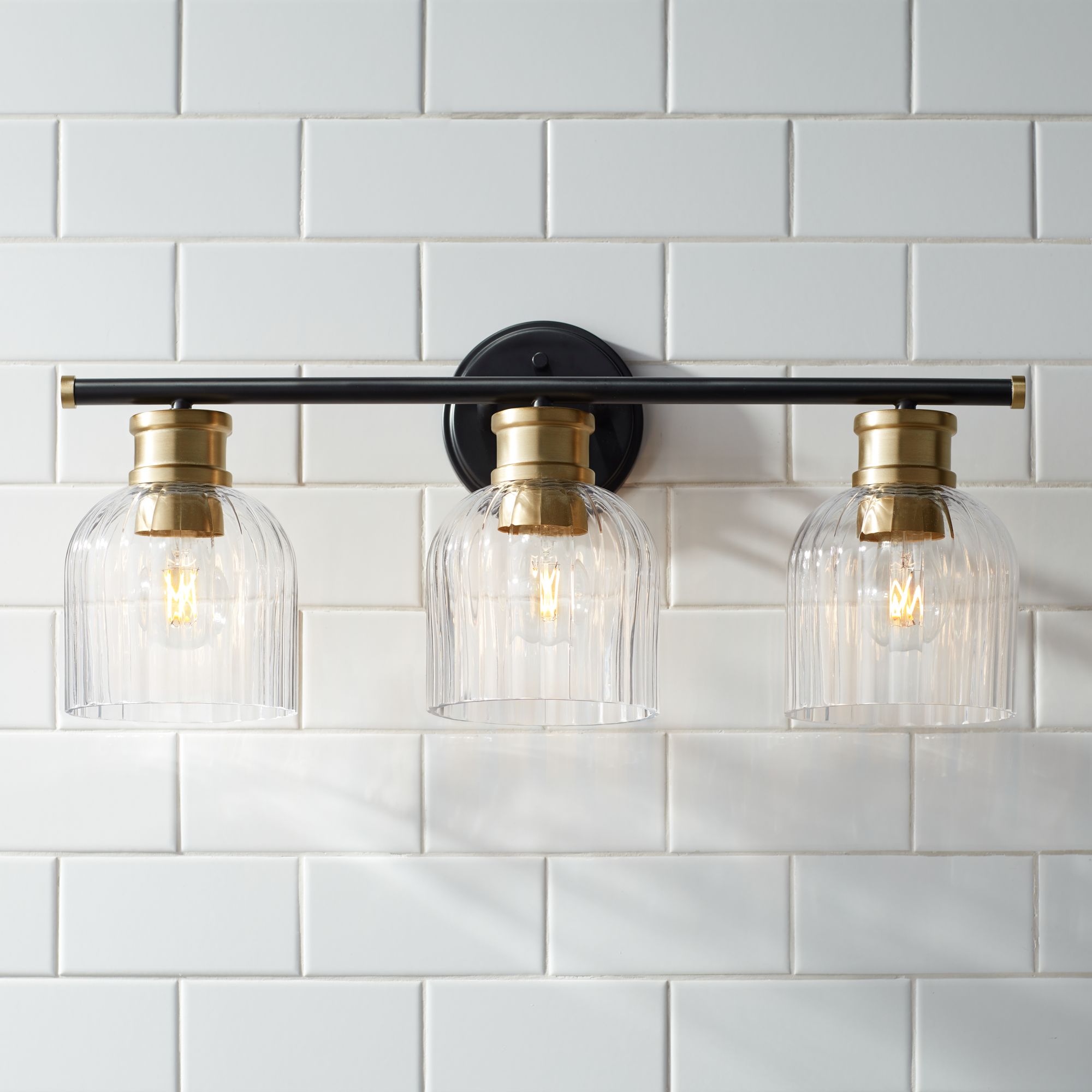 Watch A Video About the Stiffel Lana Black and Warm Brass 3-Light Bath Light