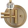 Possini Euro Kohle Brass Swing Arm Plug-In Wall Lamp with Cord Cover in scene