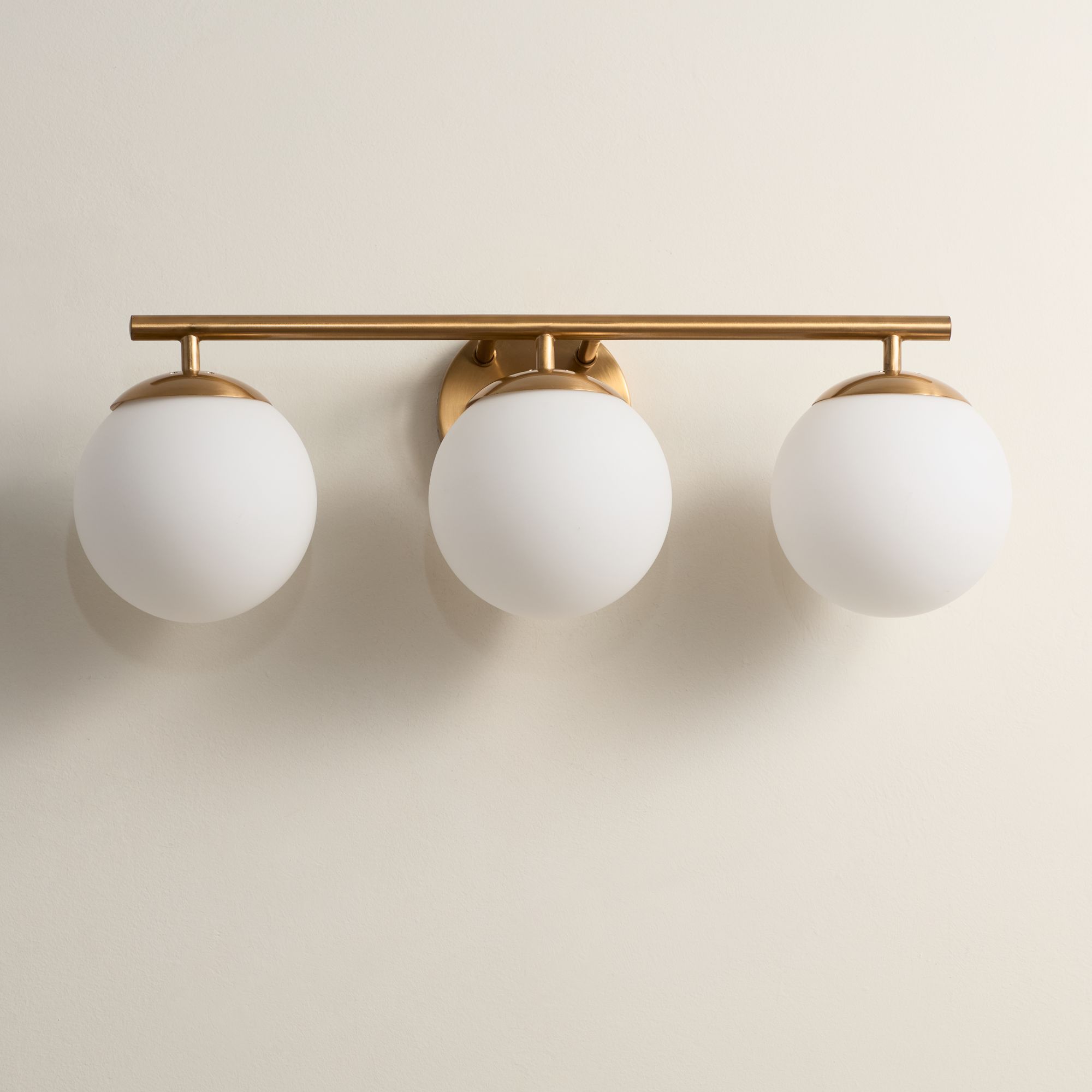Possini Euro Meridian 23" Wide Gold Frosted Glass 3-Light Bath Light in scene