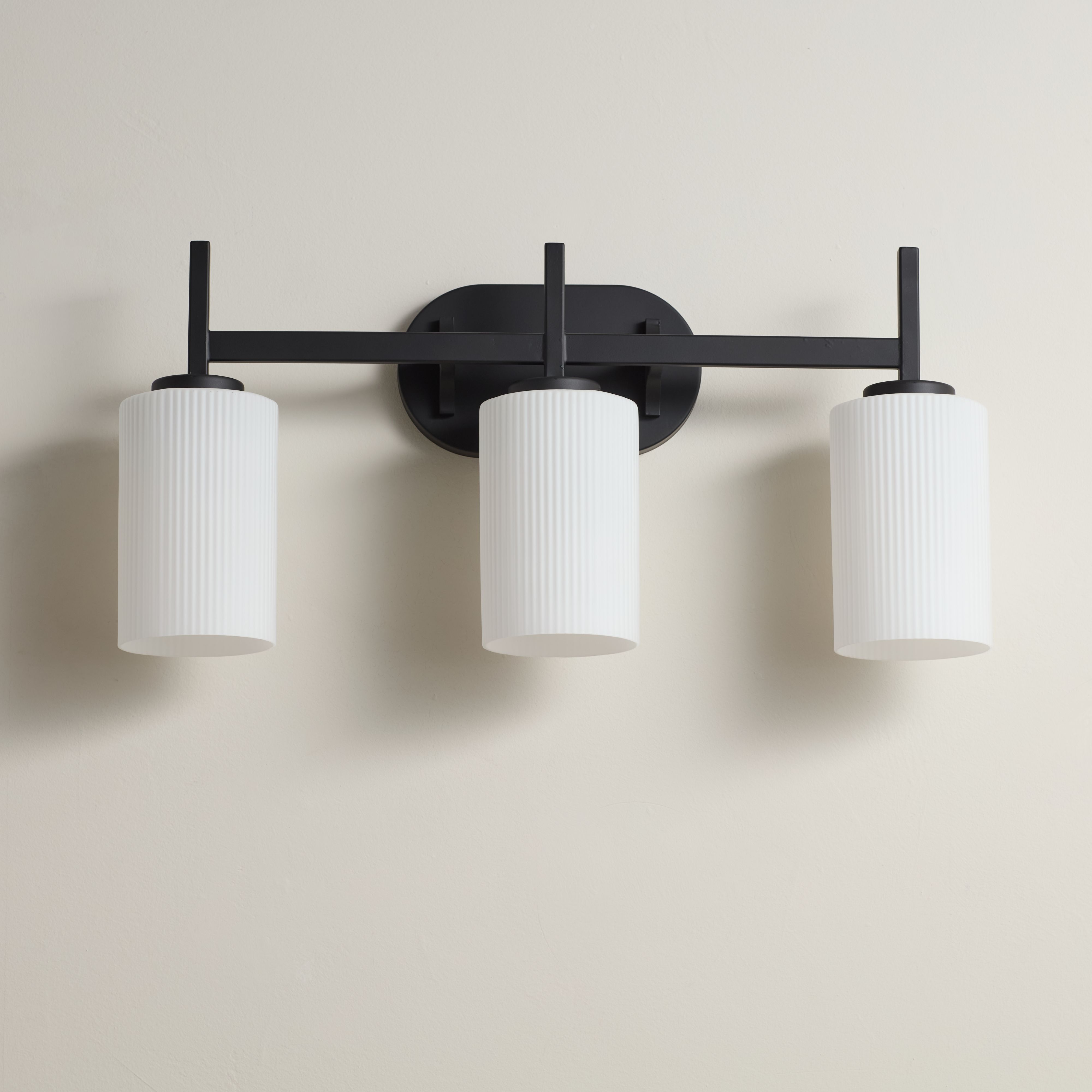 Watch A Video About the Possini Euro Nanni Matte Black Fluted Glass 3 Light Bath Light