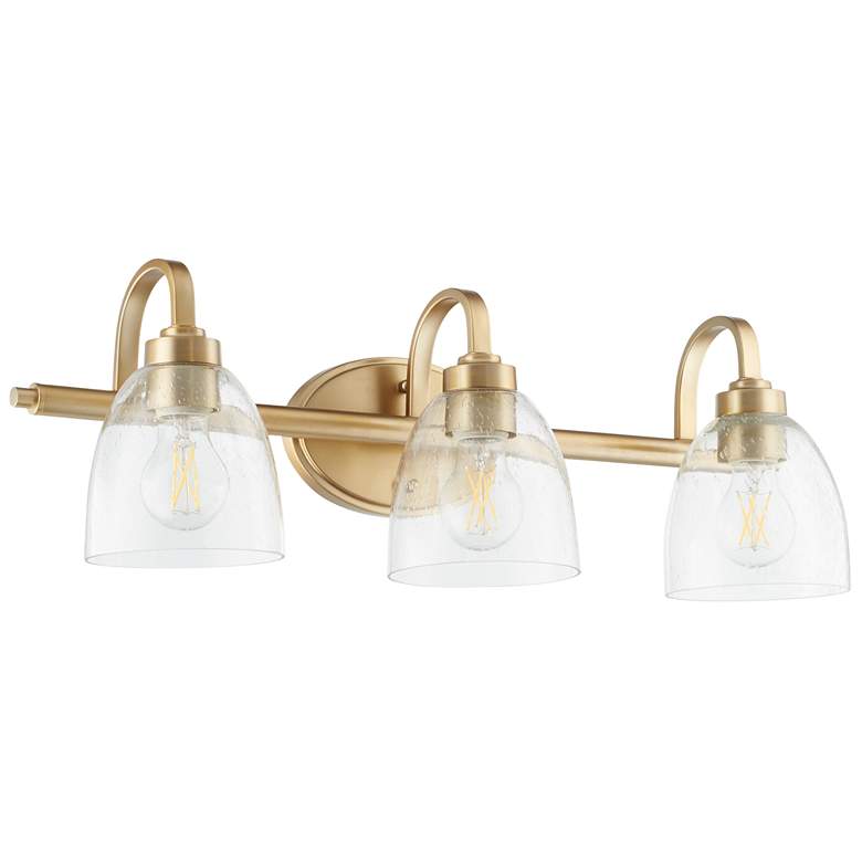 Image 1 Quorum International Reyes 3LT Aged Brass w Clear Seeded Glass Vanity Light