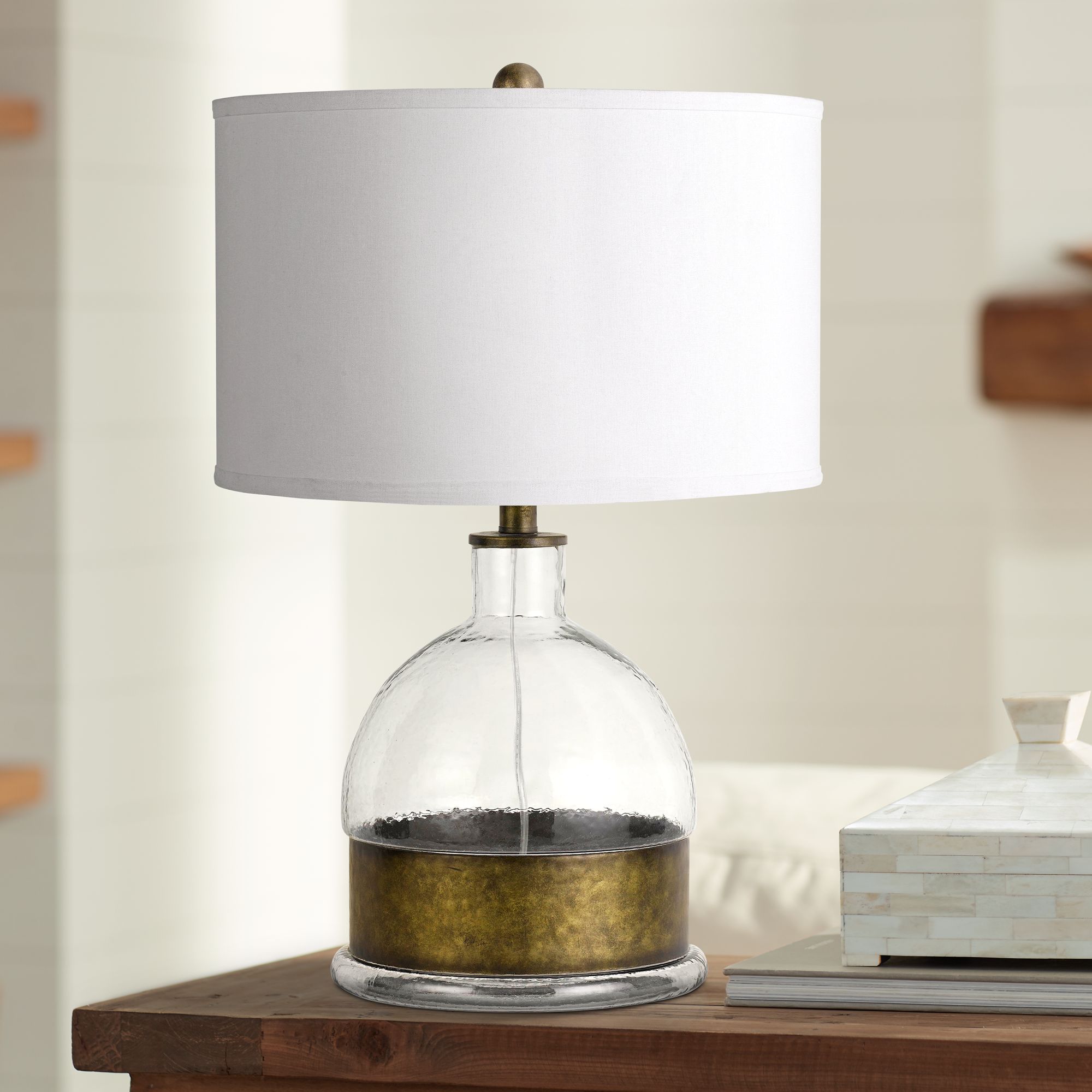 clear glass and brass table lamp