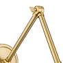 Regent Modern Gold Adjustable Swing Arm Wall Lamp in scene