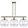 Rochester 38.5"W 3-Light Antique Brass Stem Island Light w/ Clear Shad
