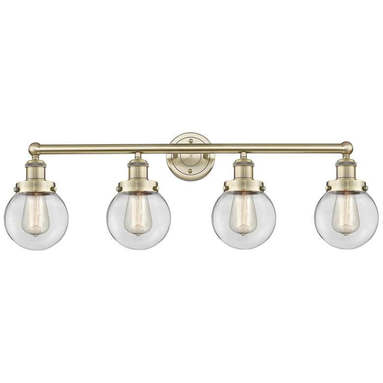 Image 1 Small Beacon 33.5"W 4 Light Antique Brass Bath Light With Clear Shade