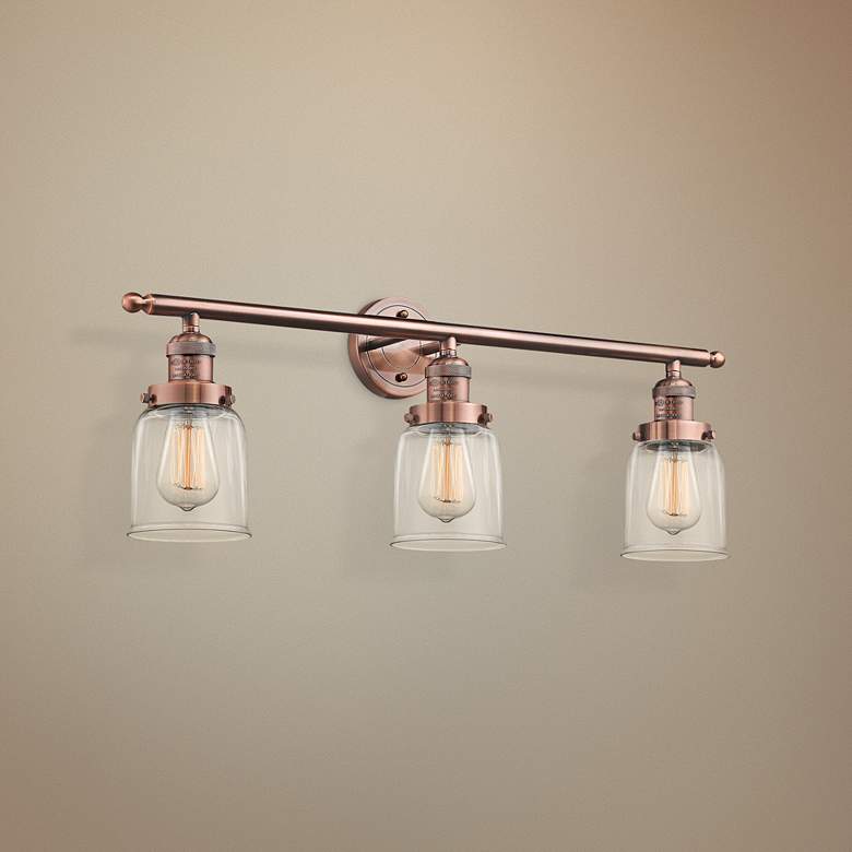 Image 1 Small Bell 30" Wide Clear Glass Antique Copper Bath Light