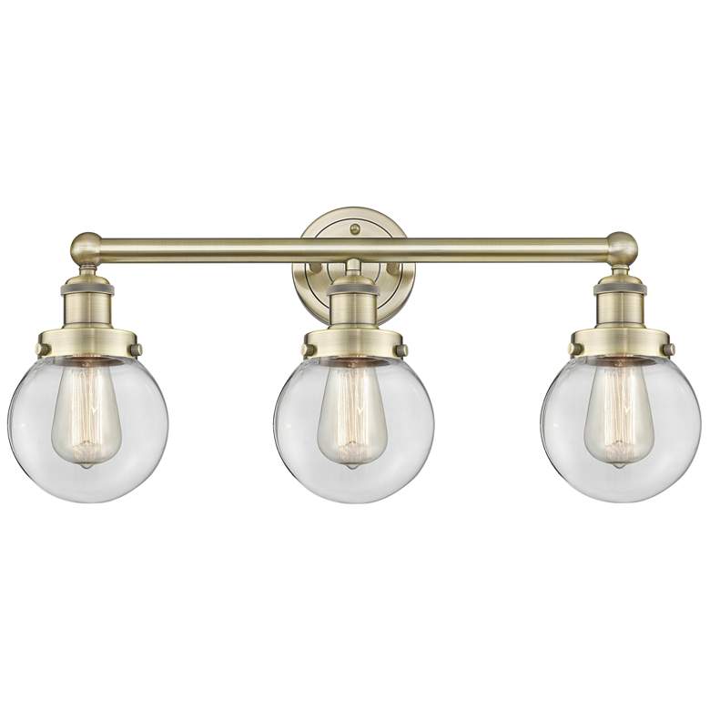 Image 1 Small Edison Beacon 24.5"W 3 Light Antique Brass Bath Light w/ Clear S