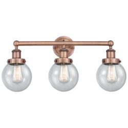 Small Edison Beacon 24.5"W 3 Light Copper Bath Light With Seedy Shade