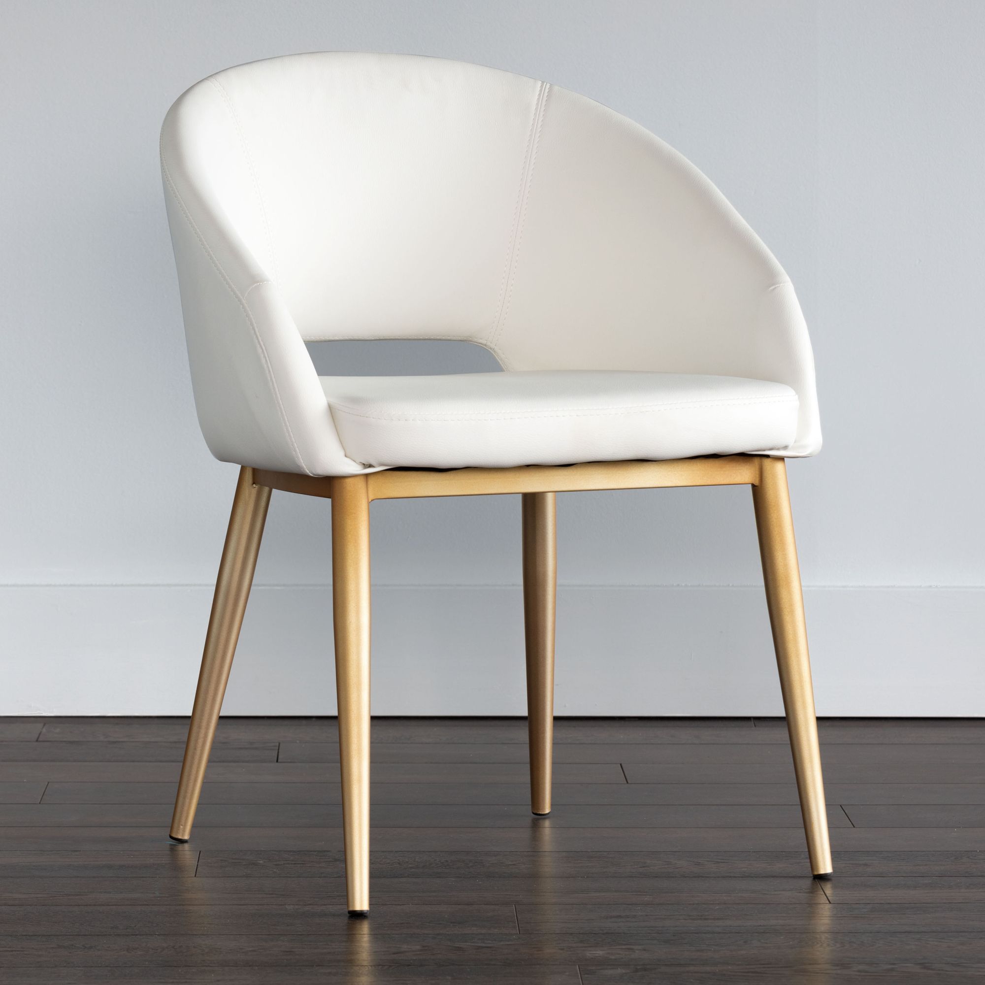 white and brass dining chairs