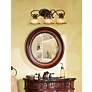 Thumbnail1 of Minka Illuminati Collection 31" Wide Bronze Bathroom Light Fixture in scene
