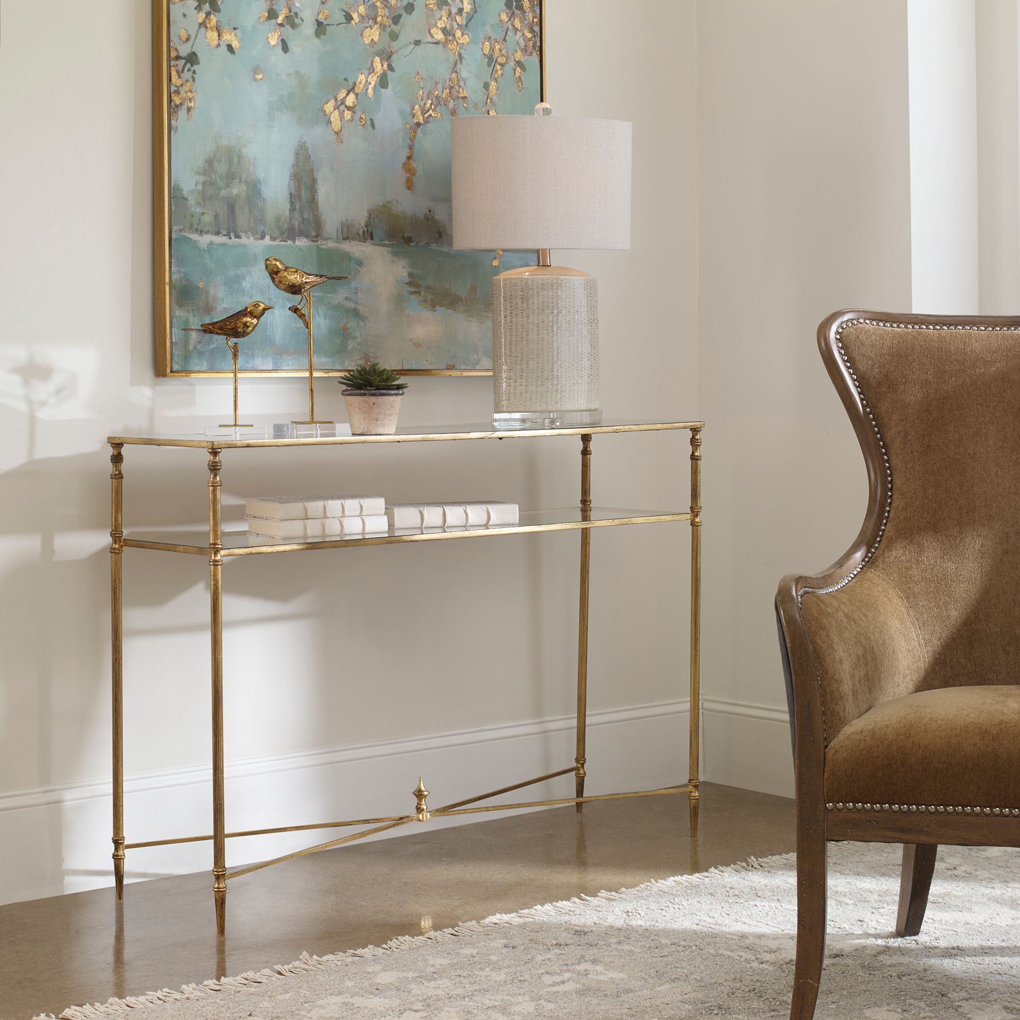 Uttermost Henzler Glass and Gold Leaf Console Table in scene