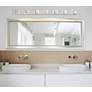 Thumbnail1 of Possini Euro Wrapped Wire 56" Wide Chrome LED Bathroom Light in scene