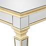 Veronica 71" Wide Gold Leaf and Mirror Dining Table in scene