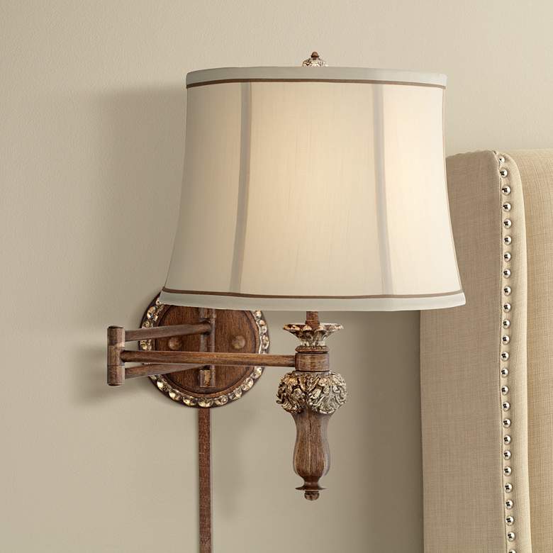 Image 1 Werner Brown and Gold Plug-In Swing Arm Wall Lamp