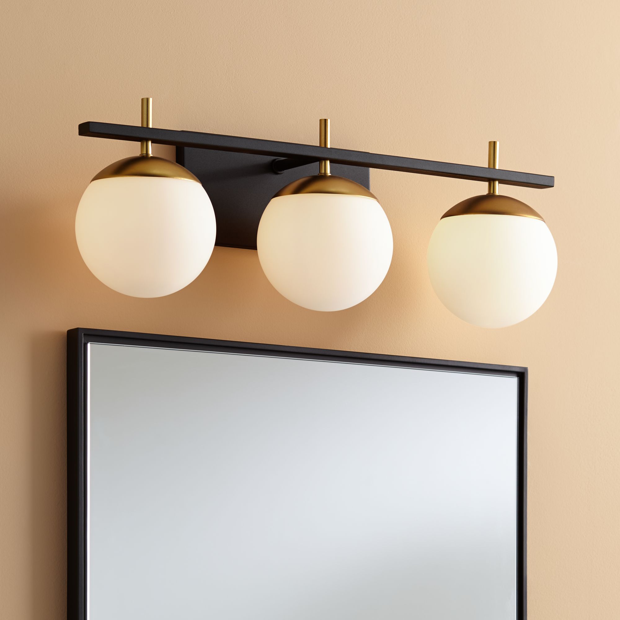 black and gold bathroom light