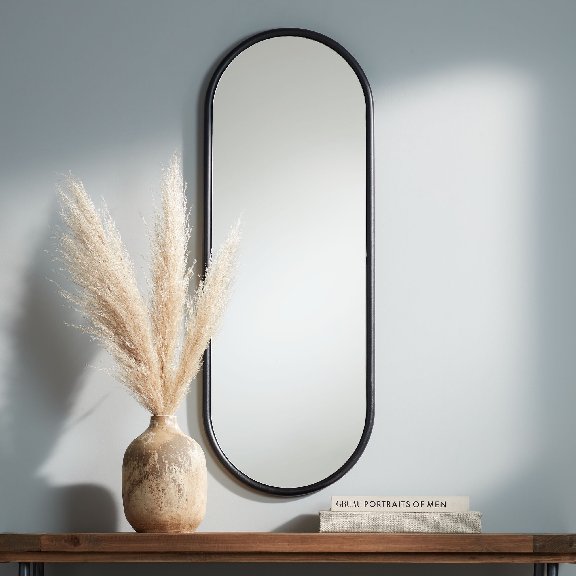 Sania 15 3/4" x 43" Wide Black Oval Wall Mirror