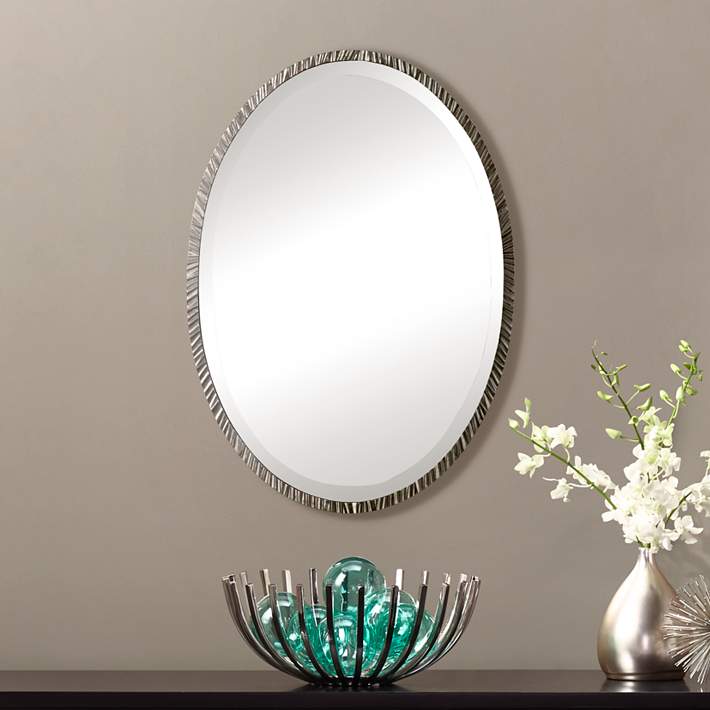 oval wall mirror with shelf