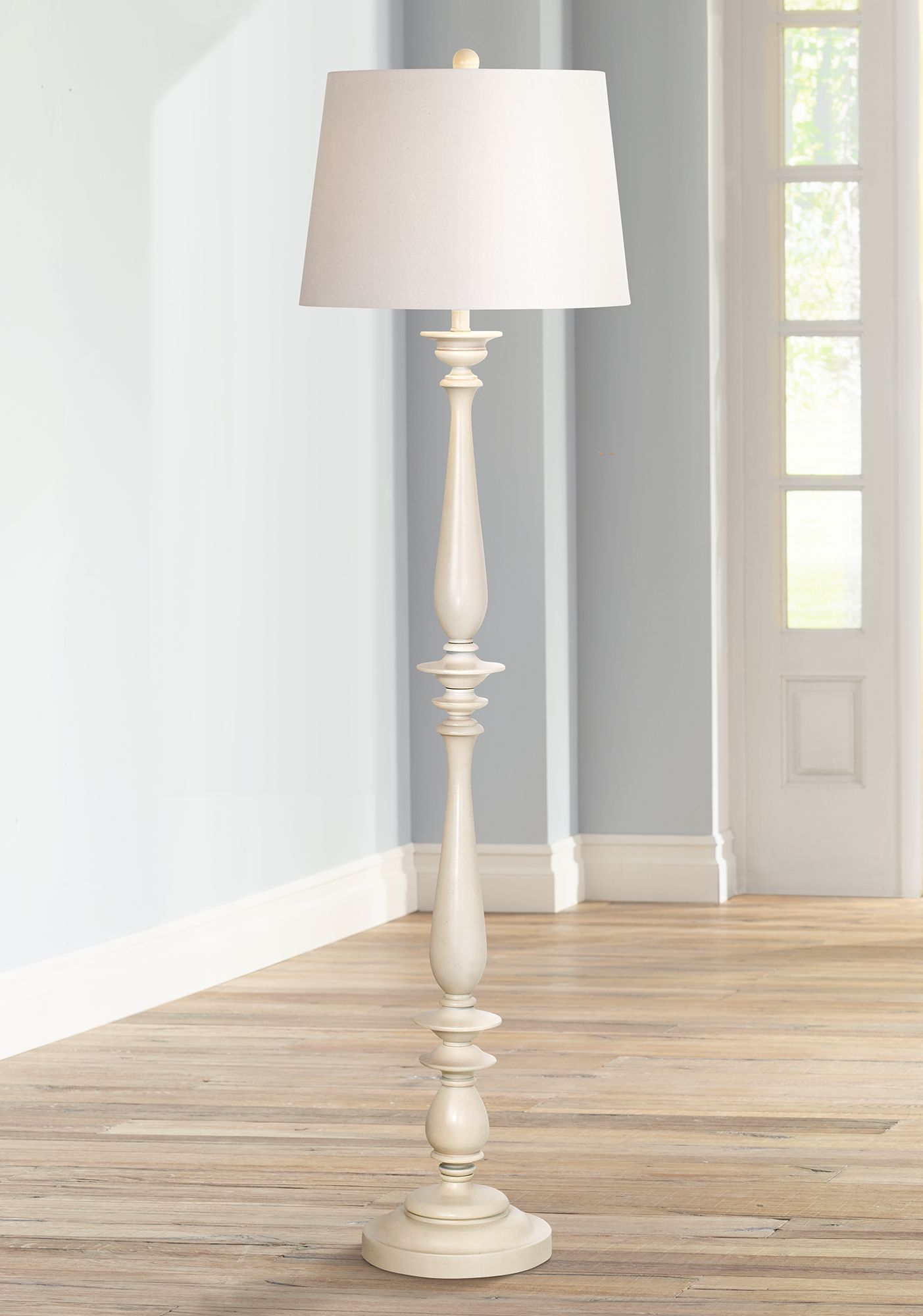 white coastal floor lamp        
        <figure class=