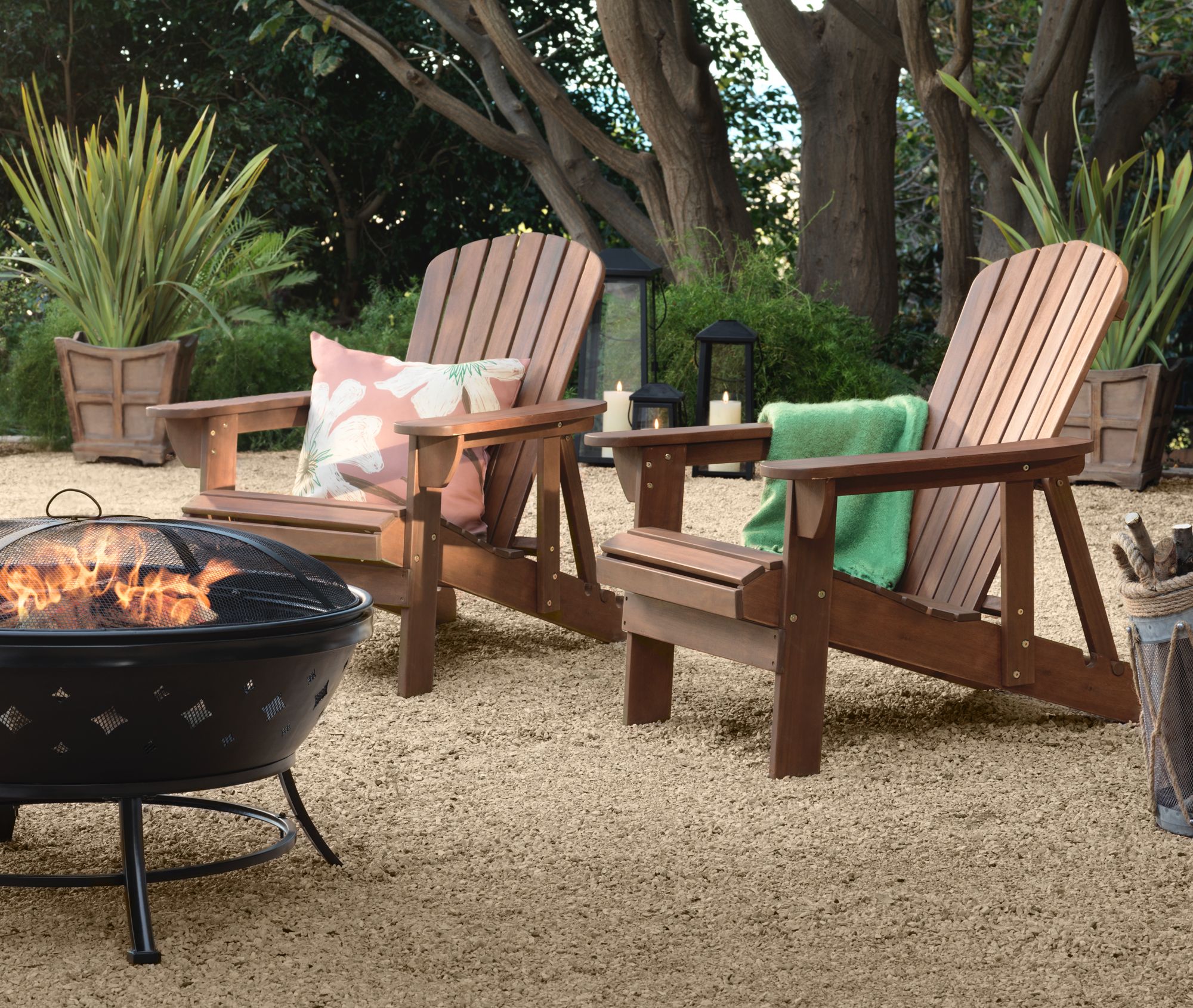 The Perfect Match Adirondack Chairs In A Garden Around A Steel Firepit Lamps Plus