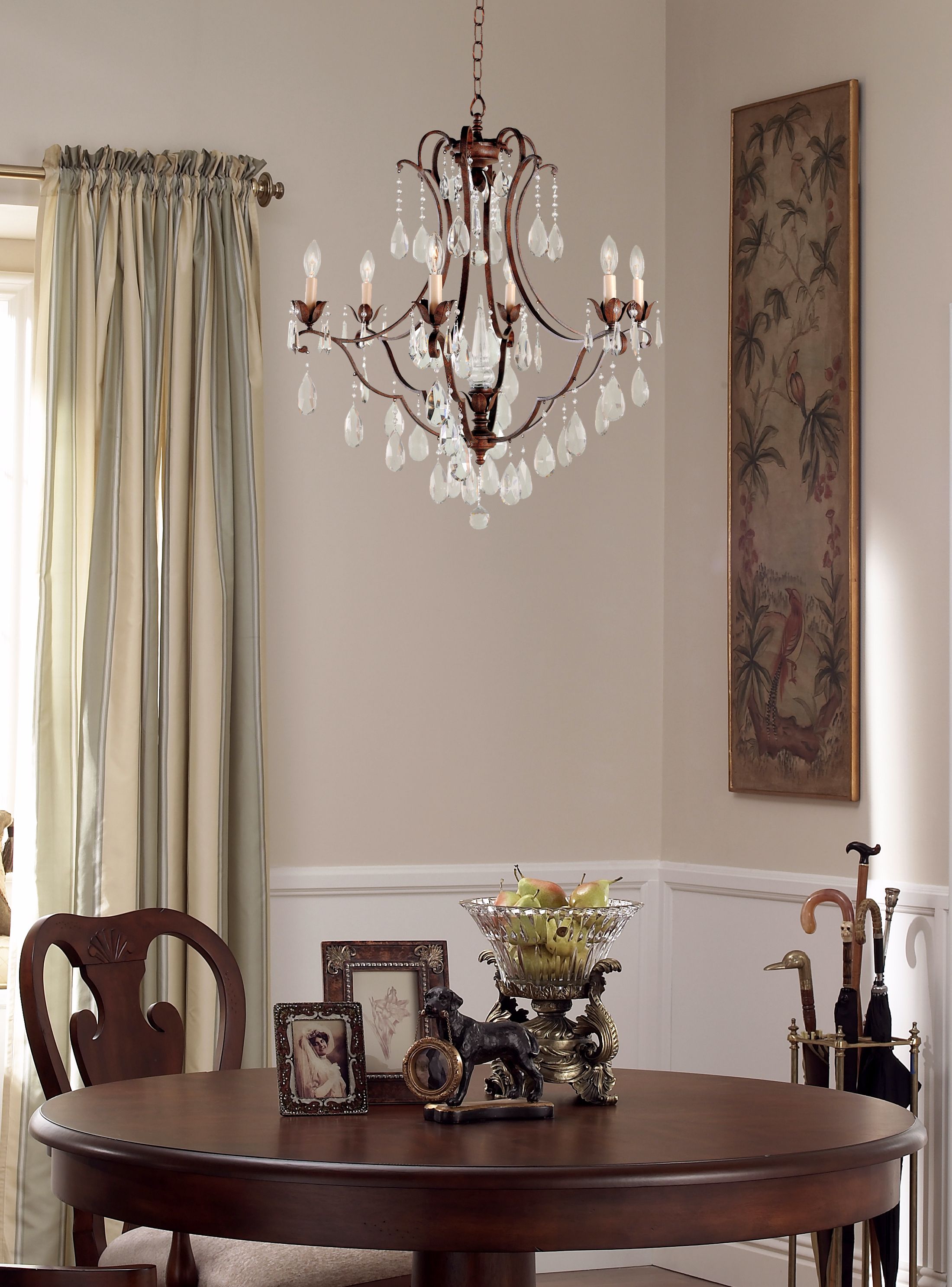 A crystal chandelier lends a classic look to this elegant entryway