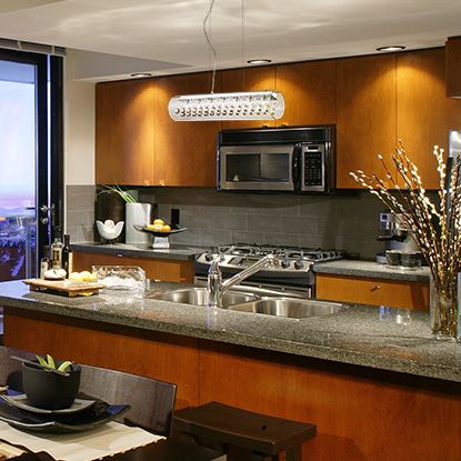 A crystal and glass contemporary kitchen island pendant makes a style